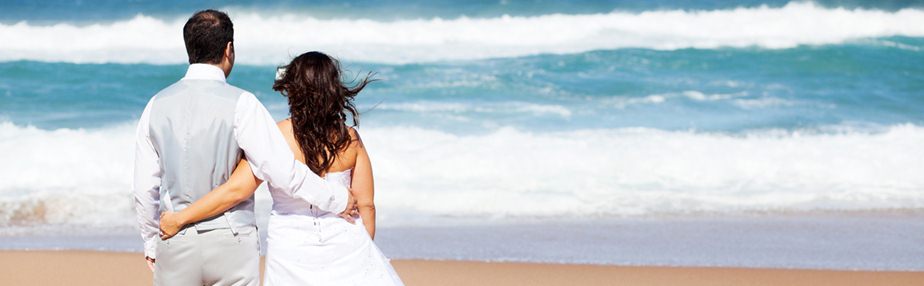 groom and bride on beach